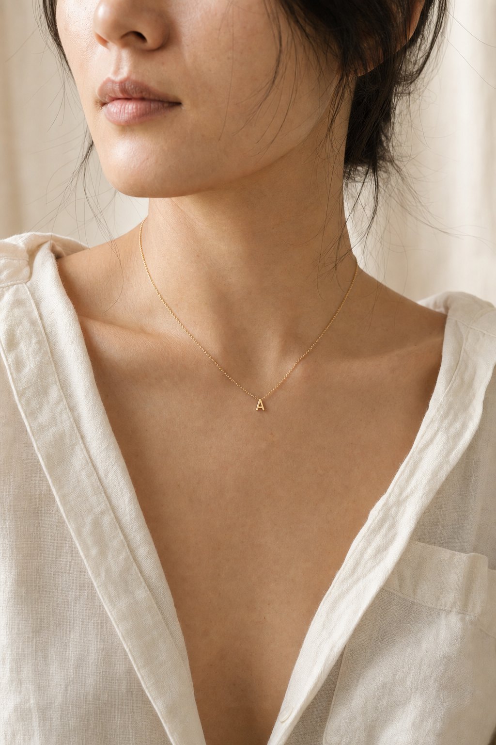 The Initial Charm wearing close image.